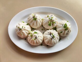 Chinese pan fried pork bun on white plate. Sheng jian bao. Traditional Chinese food