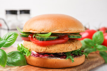 Delicious vegan burger with chickpea cutlet on table, closeup