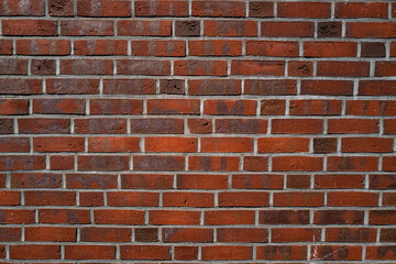 Background of brick wall. Architecture background with wall facade. Stone cladding wall background. Brick surface background for poster or banner.