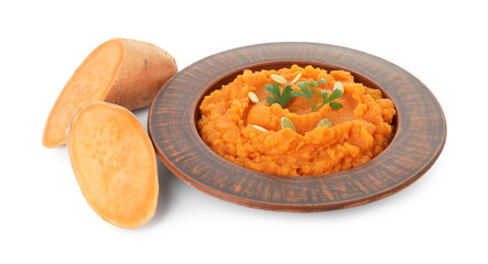 Tasty mashed sweet potato with pumpkin seeds in bowl and cut vegetable isolated on white
