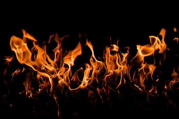 Fire flames on black background. Abstract blaze fire flame texture for banner background. Fire flames on black background. Fire flame texture.