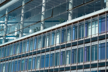 Glass wall of office building. Industry building background. Modern glass wall facade buildings. Glass wall architecture details. Modern building Exterior. Glass window.