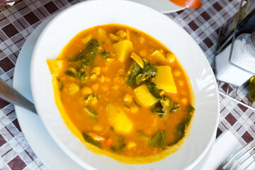 Savory garbanzo soup with spinach. Popular Spanish recipe..
