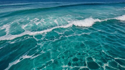 Pure blue turquoise water texture of the ocean sea with foam from and waves