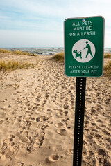 Looking toward Lake Michigan, at the dog beach at Kohler-Andrae State Park, Sheboygan, Wisconsin shoreline, with a sign that states "All Pets must be on a Leash"