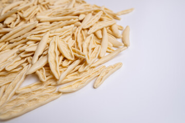 Raw pasta background close up. Different types of pasta and noodles on color background. Italian cuisine culinary concept. Collection of different raw pasta on cooking table