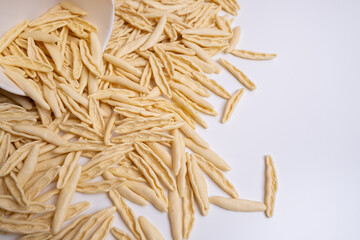 Raw pasta background close up. Different types of pasta and noodles on color background. Italian cuisine culinary concept. Collection of different raw pasta on cooking table