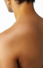 Back View of Woman's Shoulder and Upper Back, Emphasized by Low-Angle Perspective and Soft Lighting