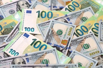 Big pile of Euro and USD banknotes. Many european and united states dollars