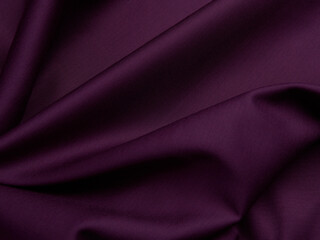 Purple fabric lies in beautiful folds. High-quality texture of purple fabric.