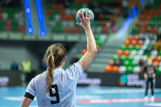 Woman player's keeps ball during handball match