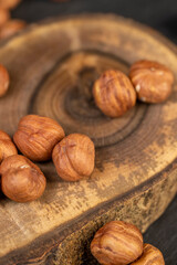 peeled raw hazelnuts on a table and a board