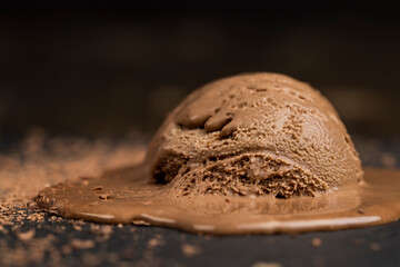 chocolate ice cream with chocolate chips on black slate