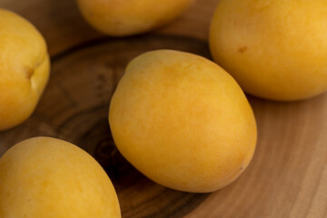 ripe soft apricot fruits on the cutting board