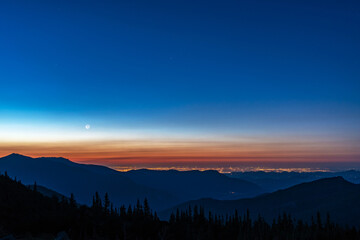 Pre dawn view of Denver Colorado and the front range from above.