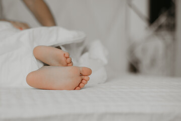 Peaceful Child Feet on Bed