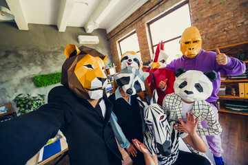 Portrait of panda rooster gorilla lion sloth zebra raccoon mask business people selfie thumb up...