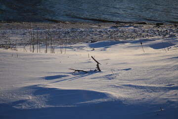 Winter landscapes in Norway showcase serene snowy mountains, icy fjords, and peaceful coastal...