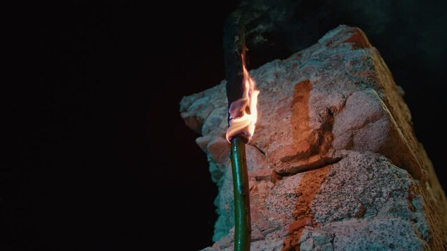 torch hanging on the wall in the night 