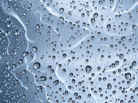 A soothing video of salam drops hitting a metal surface, creating unique patterns and sounds, metal surface, beauty