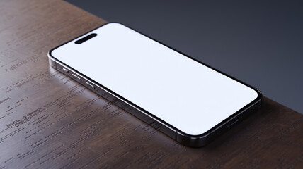 A phone is sitting on a wooden table. The phone is white and has a silver frame. The table is made of wood and has a grainy texture. Concept of simplicity and minimalism