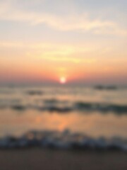 Naklejka premium Blurred sunset sky and ocean with soft pastel hues creating a serene and peaceful backdrop, ocean, soft