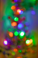 Christmas tree, toys and garland lights. Picture taken in Ukraine. Kiev region. Horizontal frame. Color image. Soft defocus. New Year.