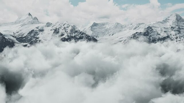 moving through white clouds and stopping in front of M&ouml;nch und Jungfrau mountain