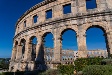 Obraz premium Pula, Croatia - November 3, 2024: View of the Amphitheater (Ancient Arena, Colosseum) monument of ancient Roman history and architecture.
