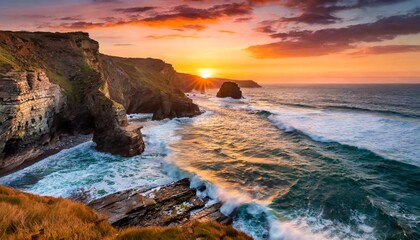 Sunset Over a Rocky Coastline With Dramatic Cliffs and Crashing Ocean Waves, Captured With Vibrant Orange and Pink Skies for a Stunning Seaside Nature Landscape