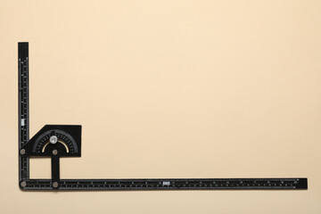 Builder's ruler on color background