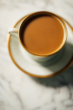 elegant cup of cafe au lait on white marble