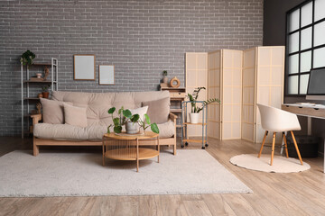 Sofa, coffee table and workplace with computer