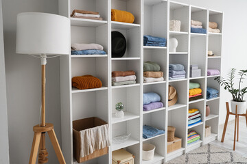 Modern wardrobe with stylish autumn clothes and accessories