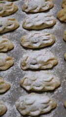 raditional Moroccan Mooncakes with Intricate Floral Pattern on Baking Sheet – Close-Up of Handmade Festival Cakes, Authentic Pastry Design, and Cultural Delicacies for Special Occasions