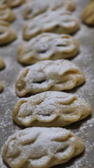 raditional Moroccan Mooncakes with Intricate Floral Pattern on Baking Sheet – Close-Up of Handmade Festival Cakes, Authentic Pastry Design, and Cultural Delicacies for Special Occasions