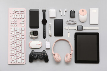 Composition with various modern gadgets on grey background