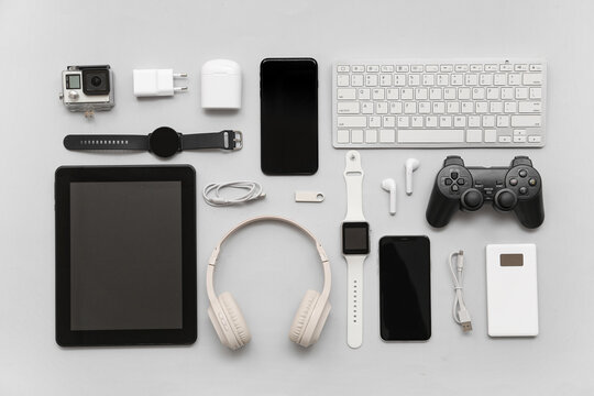 Composition with various modern devices on grey background