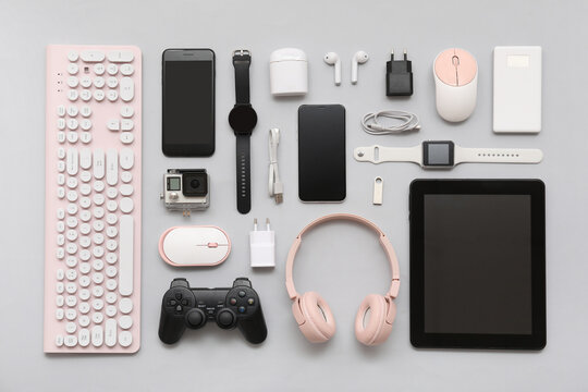 Composition with various modern gadgets on grey background