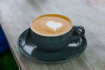 A cozy cup of coffee with a heart design on top, perfect for any coffee lover.
