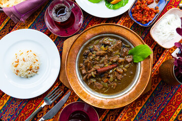 Mutancana, one of popular dishes of Ottoman Palace Cuisine from lamb with sweet dried fruits, honey and almonds