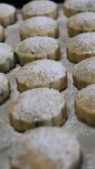 raditional Moroccan Mooncakes with Intricate Floral Pattern on Baking Sheet – Close-Up of Handmade Festival Cakes, Authentic Pastry Design, and Cultural Delicacies for Special Occasions