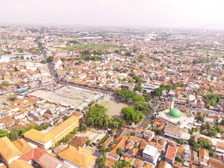 Obraz premium Bird eye view Landscape of downtown Ujung berung, Indonesia. The city center contains the grand mosque, the town square, and the busy city streets. Aerial Perspective Photography 