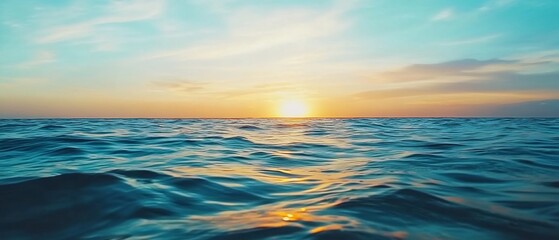 Obraz premium Breathtaking ocean sunset view with gentle waves and warm golden colors reflecting on the tranquil water A serene and picturesque coastal landscape perfect for travel vacation or relaxation themes