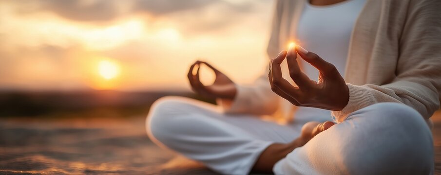 Hands holding glowing light during meditation, concept of chakra energy focus