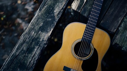 Obraz premium Close up of acoustic guitar on wood background