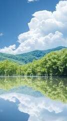 Fototapeta premium A serene landscape featuring a calm lake, lush green mountains, and fluffy white clouds.