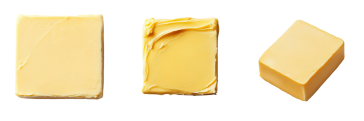 Close up view of various blocks and slabs of butter against a plain white background  This image is perfect for culinary and cooking related content showcasing the rich