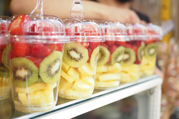 mixed fruits in a plastic jar selling at istanbul street .