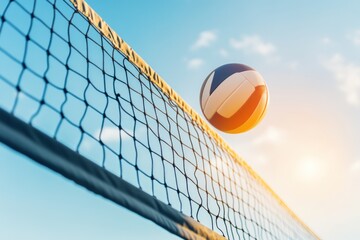 Volleyball soaring over the net with a blue sky background.